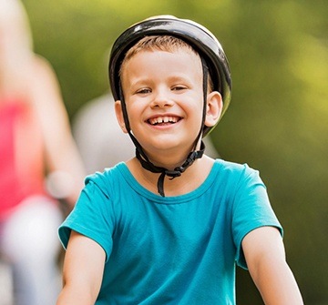 Child wearing helmet during bike ride