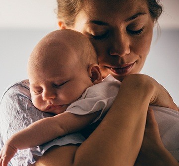 Mother holding her baby