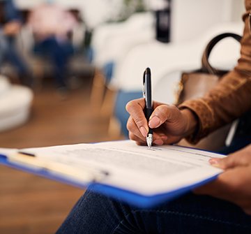 Patient filling out form in lobby