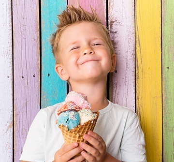 Child holding ice cream cone