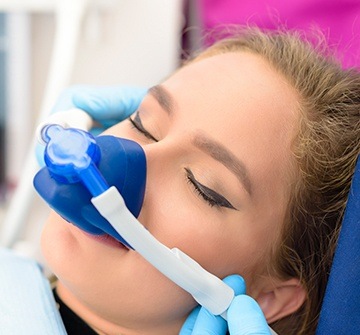 Woman with nitrous oxide nasal mask