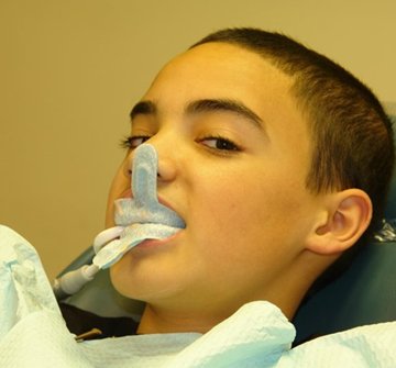 A child receiving fluoride treatment.