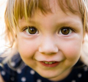 A young child smiling.