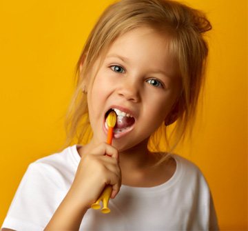 a child brushing her teeth in New Britain