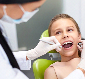 A dentist performing a dental exam.