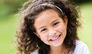 Smiling little girl outdoors