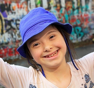 Smiling little girl with blue hat