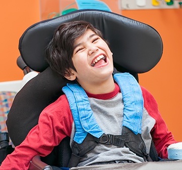 Laughing young boy in dental chair