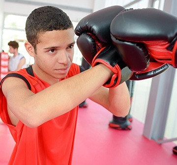 Teen boy boxing