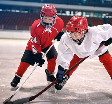Teens playing hockey