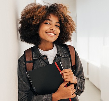 Student smiling in hallway