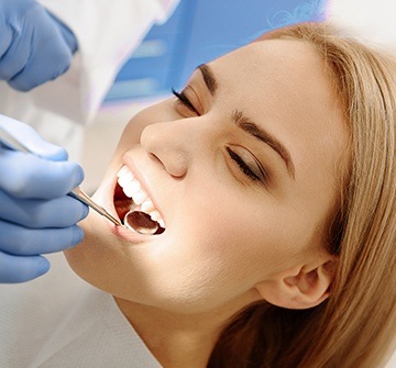 Woman receiving dental treatment