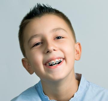Kid smiling with braces