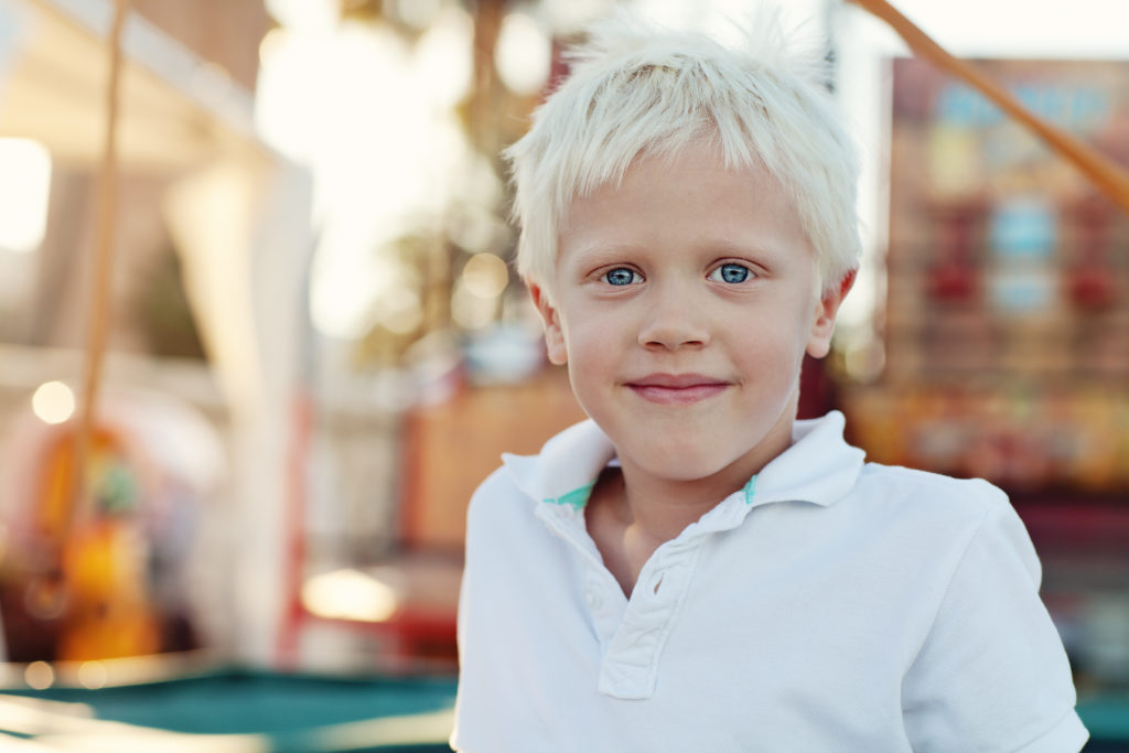 young boy smiling with blonde hair