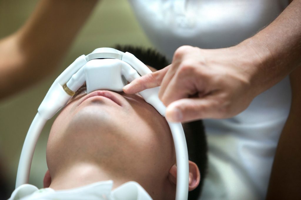 Closeup of patient using nitrous oxide at dental appointment