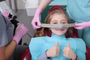 Child give thumbs up for nitrous oxide sedation for kids in New Britain