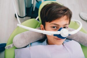 Boy receiving nitrous oxide with nasal mask